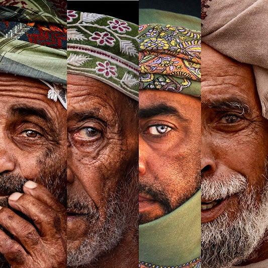 Four elderly people wearing Omani headscarves