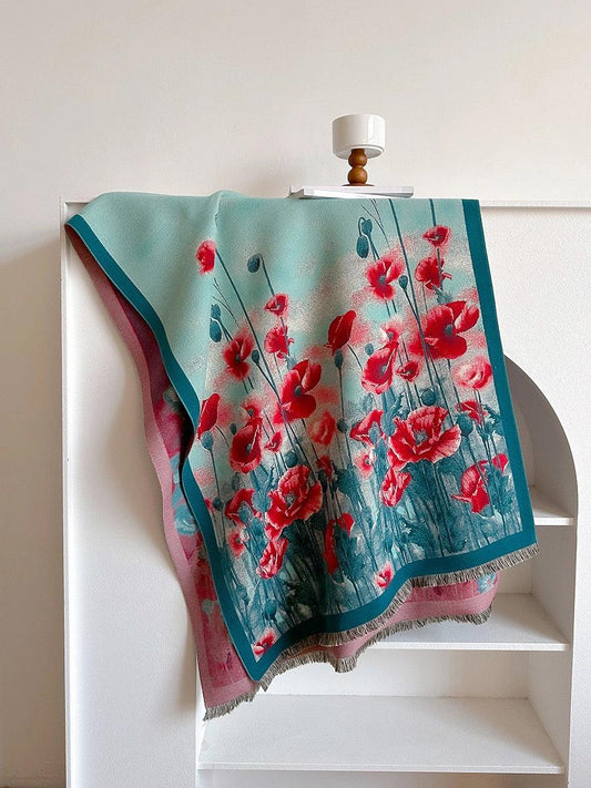 Red poppy shawl displayed broadly to show the flower field, teal border and fringed edge