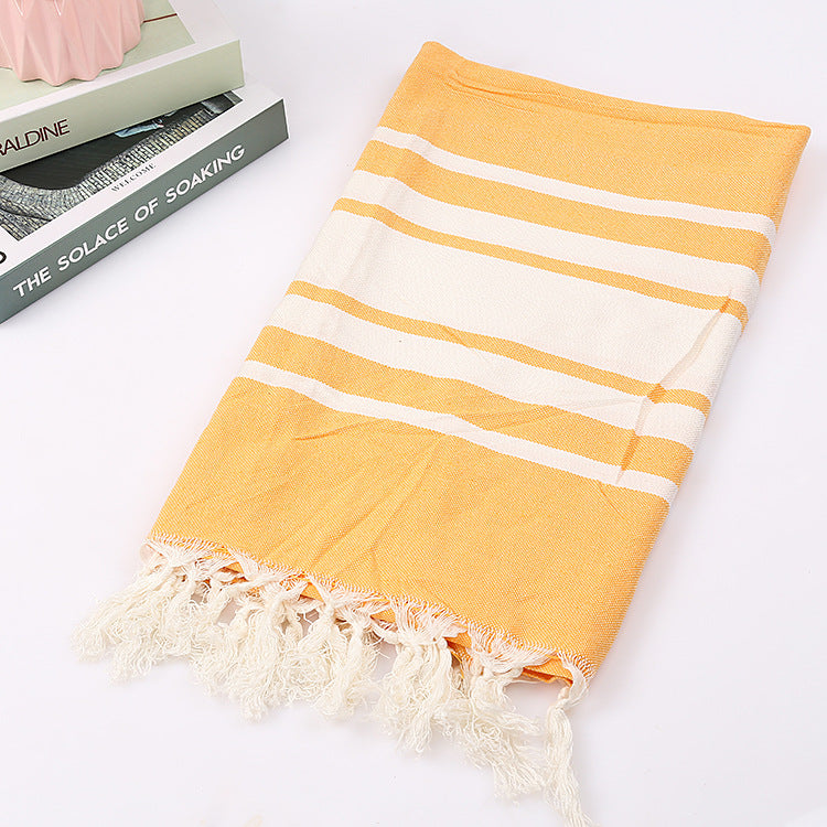 yellow turkish beach towels nearby