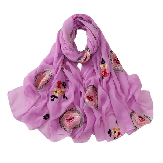 Long hijab laid out to show circular and floral embroidery placement