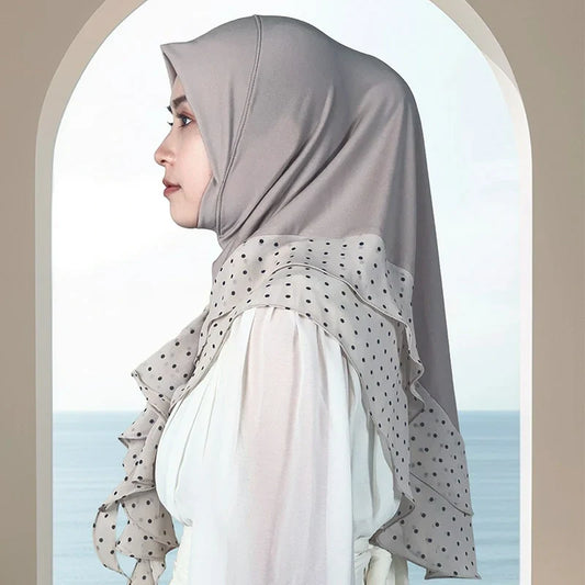 Grey hijab with a plain upper area and a pale polka-dot border on a model