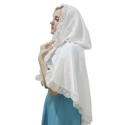 White hooded short cape in side view with a broad lace border over a blue dress