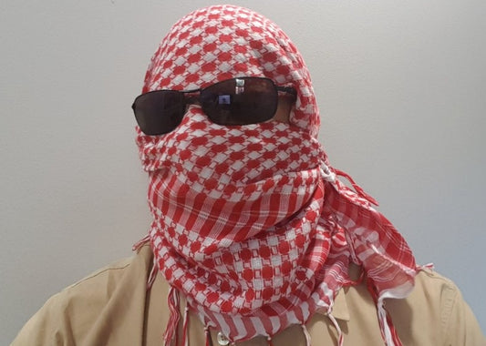 Who wears red keffiyeh?