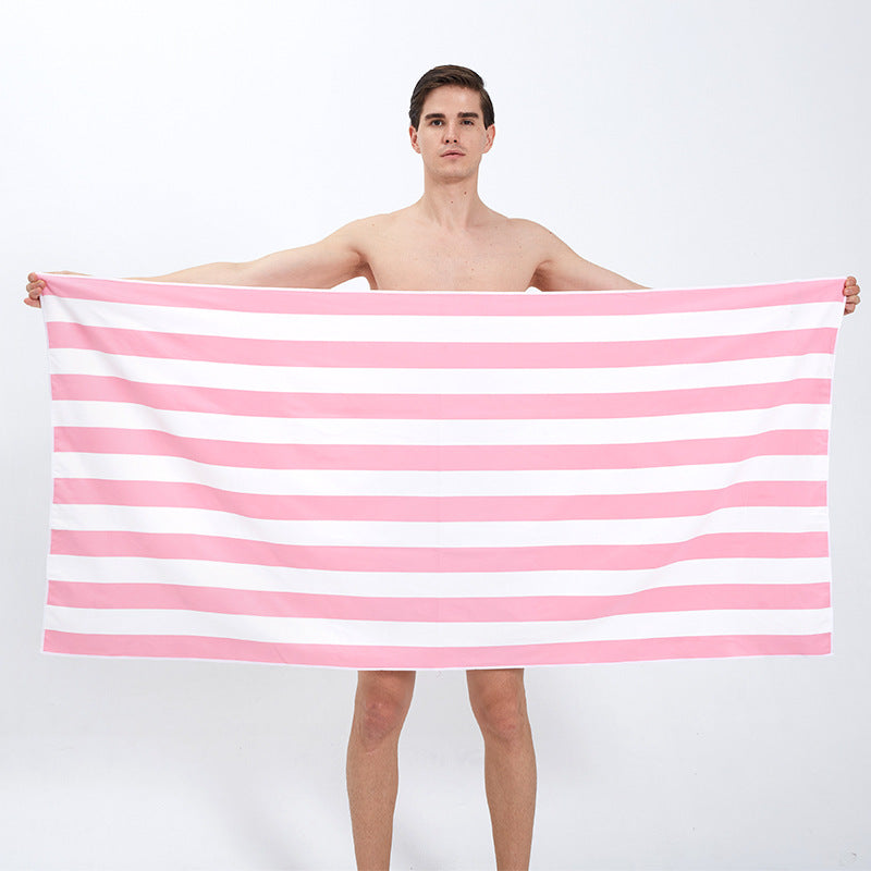 pink and white striped beach towel