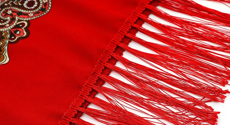 Details of the red babushka headscarf with tassels