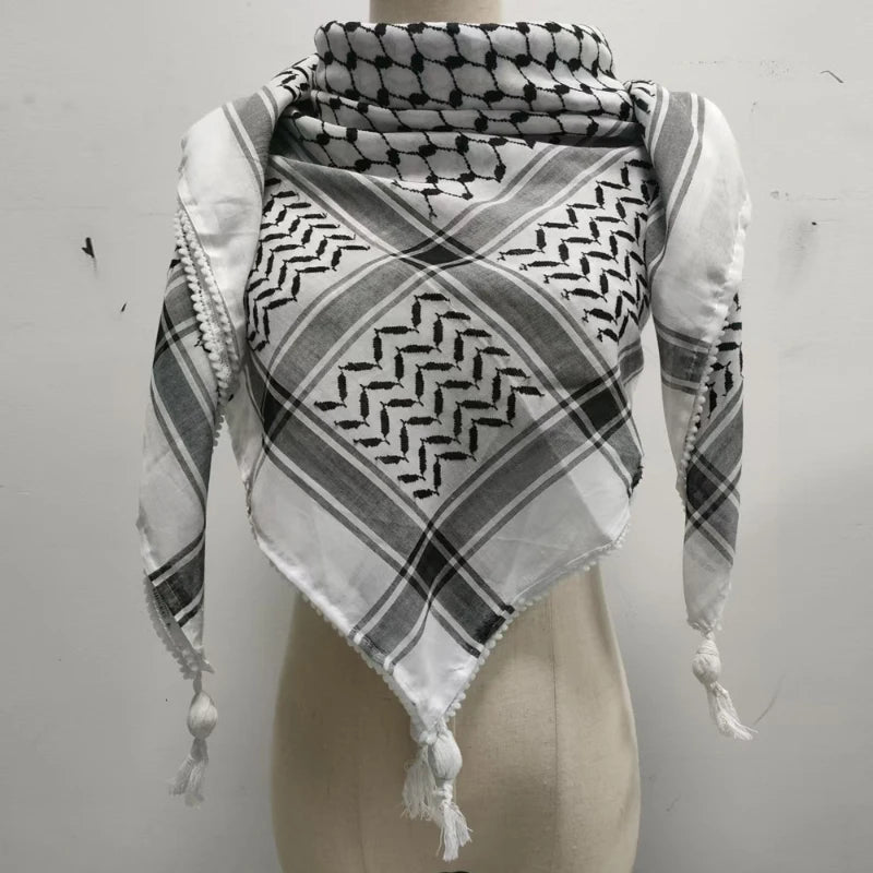 white and black keffiyeh with white small ball