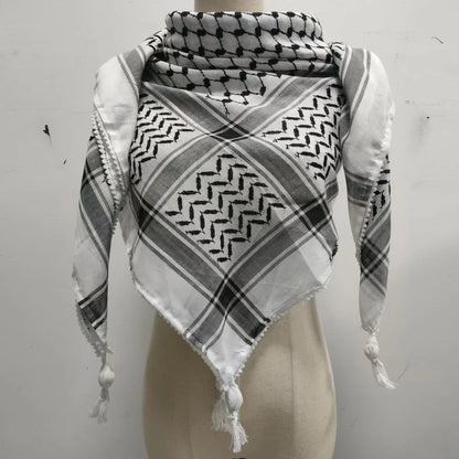 white and black keffiyeh with white small ball