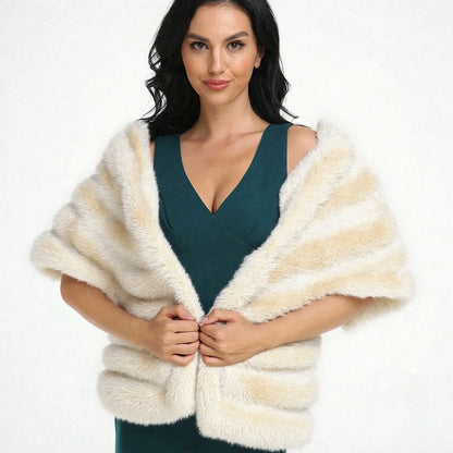 A woman wearing a white faux fur shawl