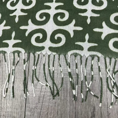 Green cross-stitch square scarf with tassels